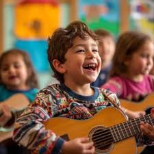 child with a smile holding a guitar